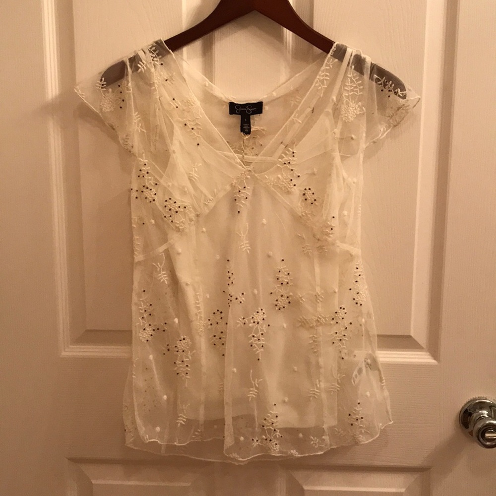 Sheer white top with white tank underlay